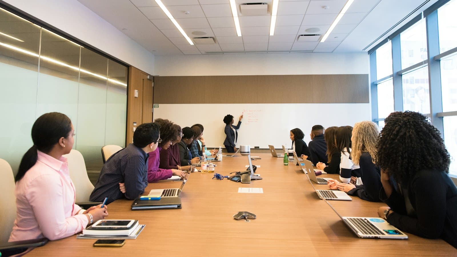 A presenter pitching to a full conference room