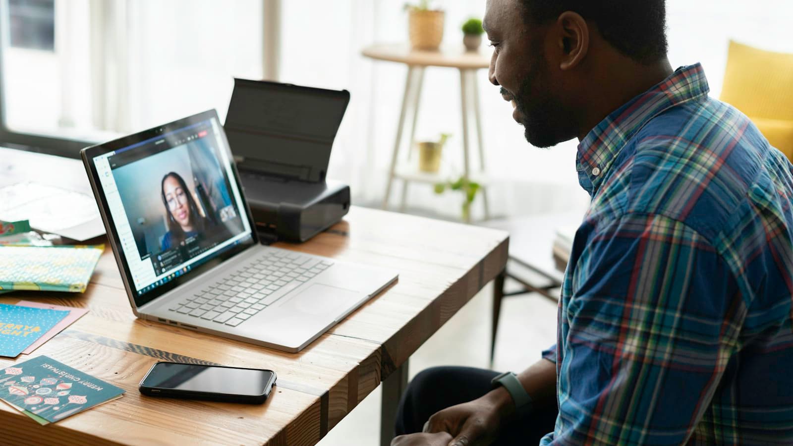 A person at a desk on a video call